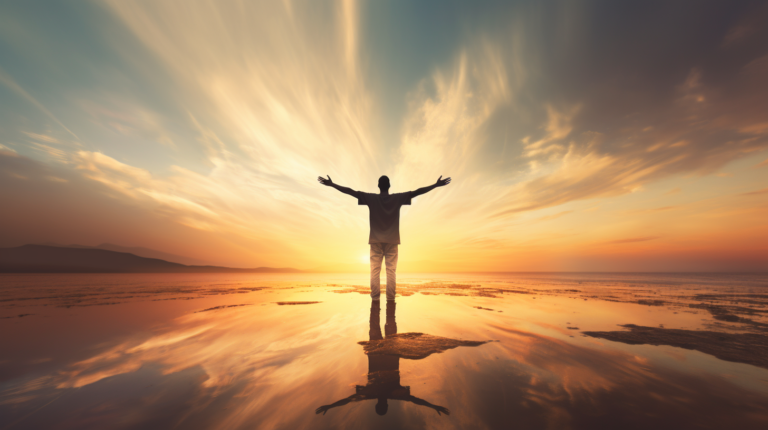 a person standing with open arms looking towards the horizon